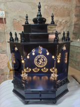 The temple is made of wood and black color. It has 1 drawers, 1 puja she - $4,817.43 MXN+