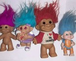 Russ Troll Lot Of 4 Red Purple Blue holding Baby - $30.00