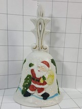 Porcelain Christmas Bell with Santa carrying a bag of presents in the snow. #658 - $6.00