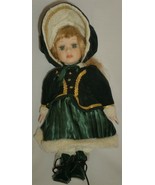 CHARMING DOLL IN A GREEN WINTER OUTFIT - $4.00