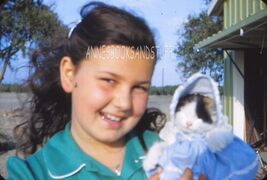 35 mm color slide * KODAK Red Border " Girl holding DRESSED UP CAT - $5.45