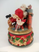 Santa Claus is Coming to Town Music Box Santa Elf Fire Place Puppy Dog Figurine - £20.04 GBP