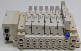 SMC SS5V2-W16SA2WD-07B-C6-6BF Manifold w/ 7 SV2200-5FU Solenoid Valves - $108.89