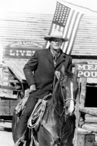 John Wayne in Chisum iconic on horseback American flag flying behind him... - $23.99