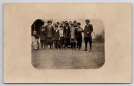 RPPC Children Ready For Ball Game Little One with Large Doll Photo Postcard V26 - £11.95 GBP