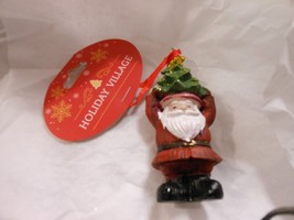 Holiday Village &quot;Santa Carrying Tree On Head&quot; Ornament NEW 4 1/2&quot; - $257.89 MXN