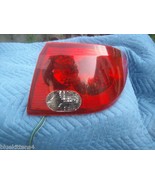 2003 SATURN L  200 300  RIGHT TAILLGHT USED OEM 4 DOOR SEDAN - $133.80