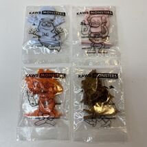 KAWS Monsters Lot Of 4 Figures KAWS 22 Limited Edition General Mills Cereal - $13.93 CAD