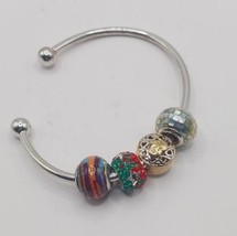 Silvertone cuff With sterling silver charms One is stamped murano italy - $95.83 CAD