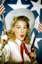 Betty Hutton in Annie Get Your Gun posing with guns and flags 24x18 Poster - £19.29 GBP
