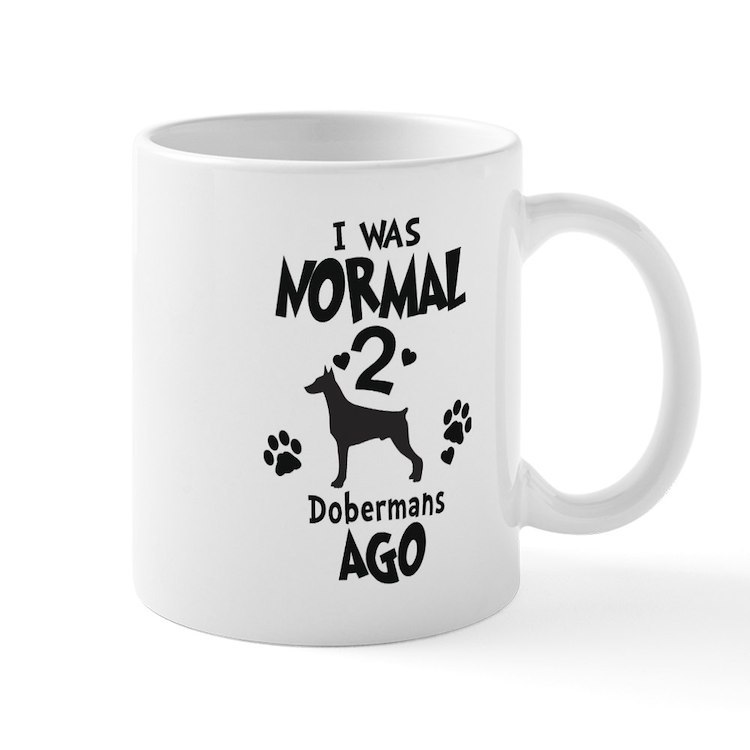 I WAS NORMAL 2 DOBERMANS AGO 11 oz Ceramic Mug - $20.00