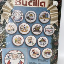 Bucilla 1993 Santas Workshop Counted Cross Stitch 3in Set of 12 Ornament... - $14.65