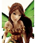 Green Fairy Pixie Sitting on Forest Lilly / Green Winged Fantasy Figurine - $27.72