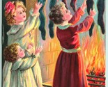 Children w Toys in Stockings Fireplace Merry Christmas Embossed DB Postc... - $11.83