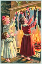 Children w Toys in Stockings Fireplace Merry Christmas Embossed DB Postcard I10 - £9.45 GBP