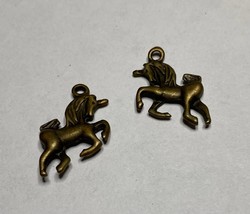 Unicorn, charm, antique brass, 1/2&quot; long, double sided - $18.77 MXN