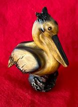 Vintage Small Resin Brown Pelican Figure Sitting on a Log 4.25&quot; Tall - $220.14 MXN