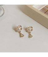 S925银针春夏款网红创意镂空镶钻珍珠水滴耳坠设计感耳环937Y3 - $8.98 MXN