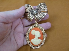 CA20-101) RARE African American LADY orange + white CAMEO bow dangle Pin... - $538.54 MXN