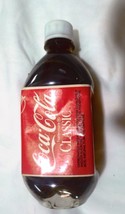 Coca Cola Classic   16 fl oz plastic bottle  full  with circle bottom - £6.83 GBP