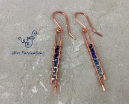 Handmade copper earrings: long narrow wire wrapped blue crystal glass beads - $24.00