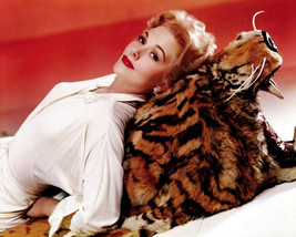 Kim Novak lying on tiger skin rug 16x20 Poster - £15.62 GBP