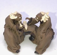 Miniature Ceramic Figurine Two Mud Men Sitting on a Bench Playing Music-... - £5.42 GBP