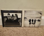 Lot of 2 U2 CDs: The Joshua Tree, All That You Can&#39;t Leave Behind - $8.54