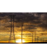 Silhouette of large metal powerline towers with colourful clouds and sun... - £31.63 GBP