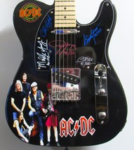 AC/DC Autographed Guitar - £2,768.33 GBP