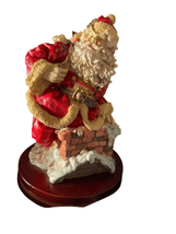 Vintage Christmas Santa Claus Figurine Going Down The Chimney on Wooden Base - $32.73