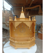 The temple is made of wood and golden color. It has 1 drawers, 1 puja she - $5,391.38 MXN+