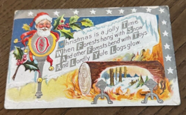 1911 Antique Embossed M.L. Jackson Christmas Santa Log Fire Postcard USED - $9.46