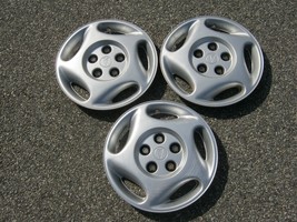 Factory original 1992 to 1996 Pontiac Trans Port bolt on hubcaps wheel covers - $32.38