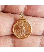 1/10 Oz. American lady liberty eagle gold coin encased in designer pendant - $587.00