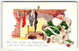 Santa Claus Christmas Postcard Green Suit Chair Black Cat Sleeps By Fireplace - £9.67 GBP