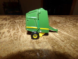 1/64 ertl john deere round baler w/plastic bale in nice shape used - $20.00