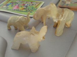 Lot of 4 Vintage Elephant Figurines 2 Stone 2 Plastic - £15.03 GBP