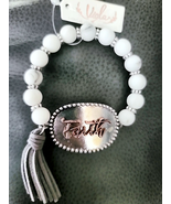 Faith Stretch Bracelet with Leatherette tassle NEW - $17.82 CAD