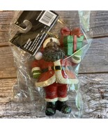 The Christmas shop black Santa Claus ornament holding gift - $18.69