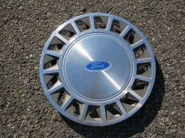 One genuine 1987 to 1994 Ford Tempo Aerostar 14 inch hubcap wheel cover nice - $23.03