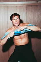 Adam West 11x17 Mini Poster Cheesecake Photo Bare Chest Putting On T-Shirt - $18.31 CAD