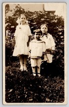 RPPC Children Girl and Boys in the Yard for Photo c1910 Postcard I28 - £5.53 GBP