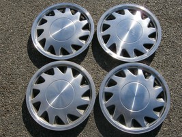 Factory original 1988 to 1990 Plymouth Sundance 14 inch hubcaps wheel covers - $55.75