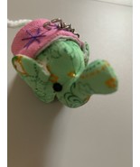 Green elephant cloth mascot keychain - $317.60 MXN