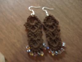 Long Espresso colored earrings with topaz colored beads and silver ear wire - $133.25 MXN