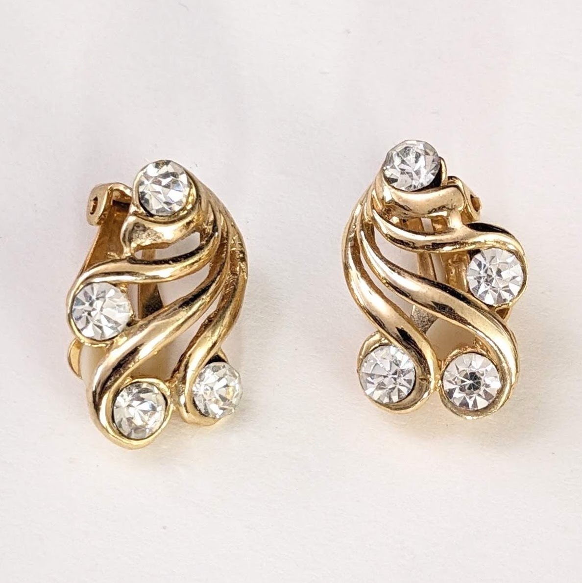 Primary image for Vintage Rhinestone and Gold Swirl Clip-On Earrings, 1 in.