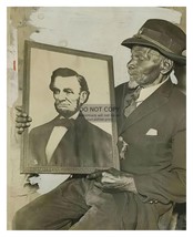 BLACK CIVIL WAR SOLDIER HOLDING PORTRAIT OF PRESIDENT ABRAHAM LINCOLN 8X... - $11.32