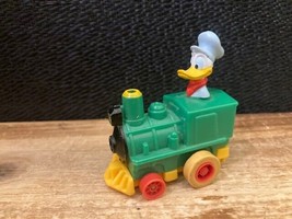 VINTAGE WALT DISNEY TOY- PULL BACK &amp; GO DONALD DUCK IN GREEN TRAIN 2.25&quot; - £3.53 GBP