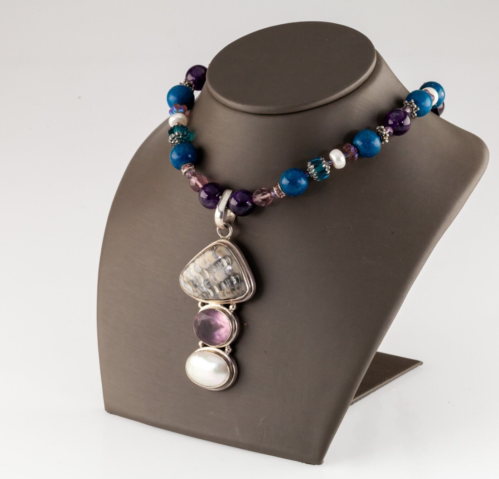 Gemstone Beaded Necklace with Mother of Pearl, Amethyst, and Fossil Clam Pendant - £423.65 GBP